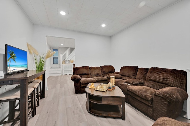 living room featuring light wood finished floors and recessed lighting