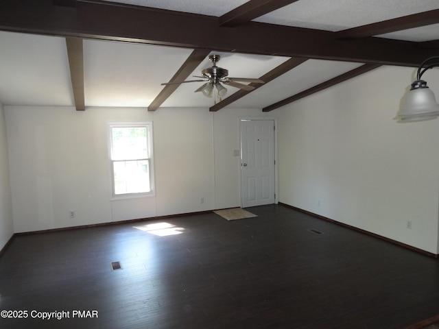 empty room with ceiling fan, baseboards, dark wood finished floors, and vaulted ceiling with beams