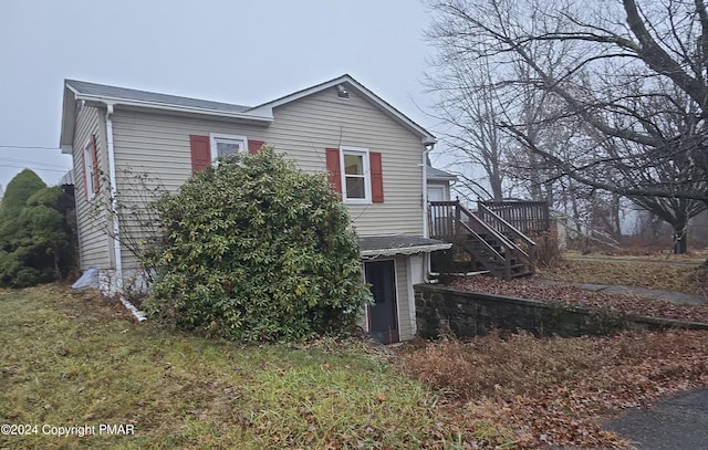 view of front of home featuring stairs