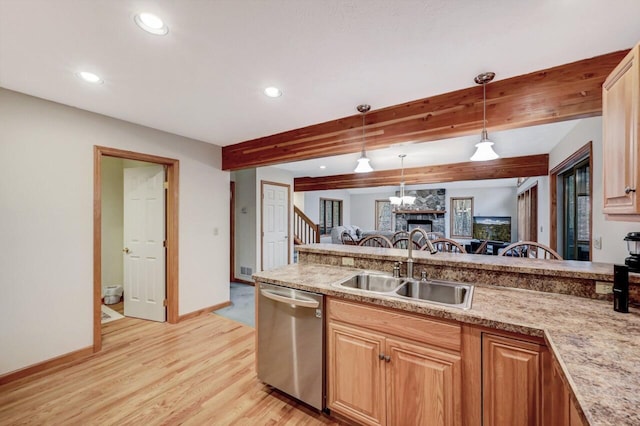 kitchen featuring hanging light fixtures, dishwasher, a sink, beamed ceiling, and recessed lighting