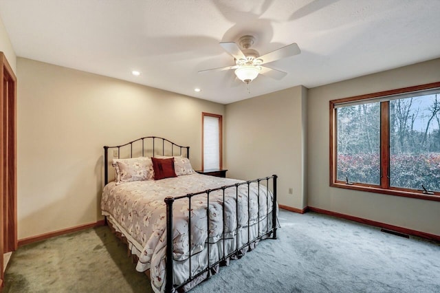 bedroom with recessed lighting, baseboards, light carpet, and a ceiling fan