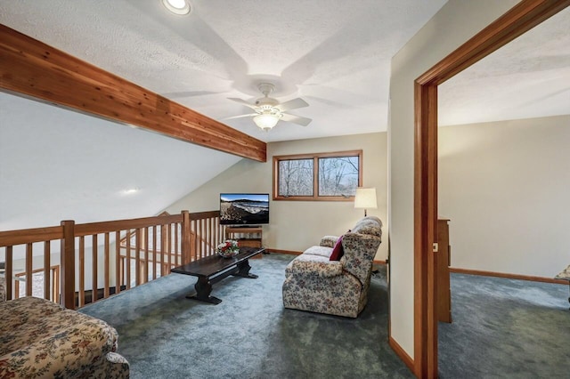 sitting room featuring carpet floors, a ceiling fan, baseboards, and a textured ceiling