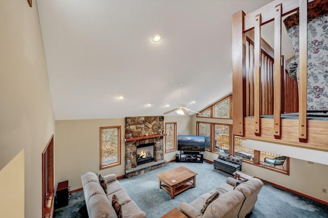 living area with ceiling fan, a fireplace, carpet floors, high vaulted ceiling, and baseboards