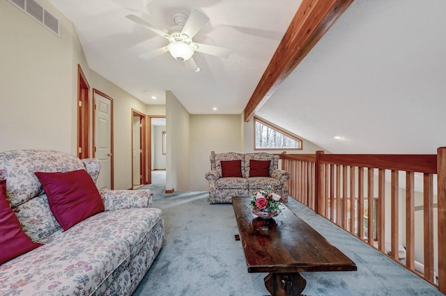 living room with a ceiling fan, visible vents, lofted ceiling with beams, and carpet