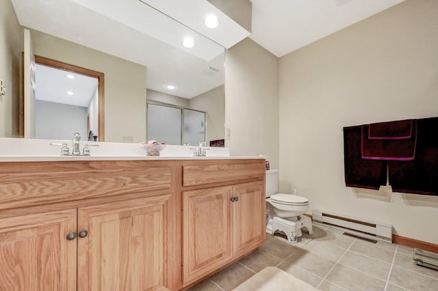 full bathroom featuring a sink, double vanity, toilet, a shower stall, and a baseboard heating unit