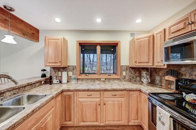 kitchen with visible vents, a sink, stainless steel microwave, electric stove, and light brown cabinets