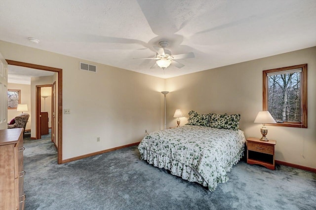 carpeted bedroom featuring a ceiling fan, baseboards, and visible vents