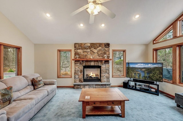 carpeted living area featuring baseboards, vaulted ceiling, and a fireplace