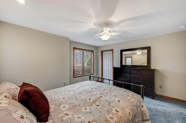 carpeted bedroom with baseboards, ceiling fan, and a closet