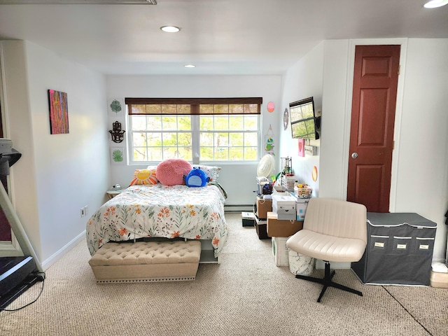 carpeted bedroom with a baseboard radiator, baseboards, and recessed lighting