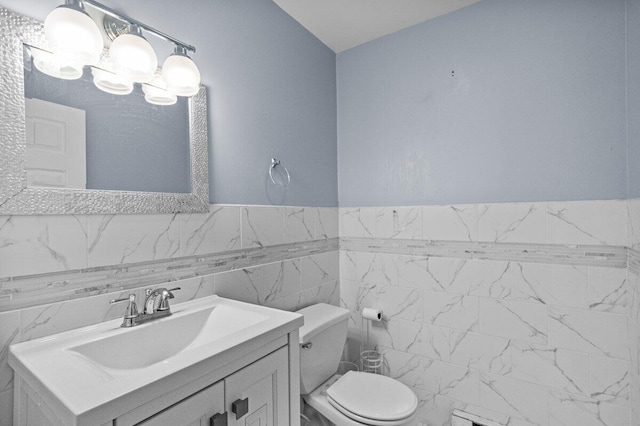 240 Timberline Dr, East Stroudsburg, PA 18301 - half bathroom with vanity, tile walls, and wainscoting