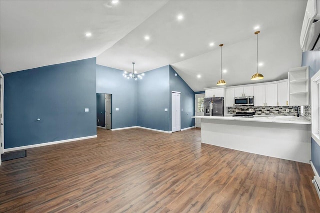 kitchen featuring white cabinets, appliances with stainless steel finishes, open shelves, and open floor plan