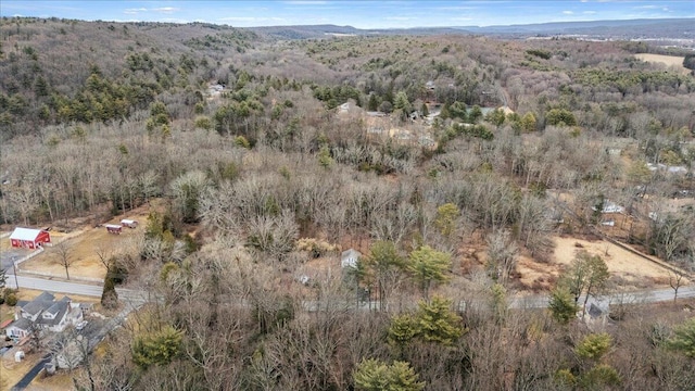 drone / aerial view featuring a forest view