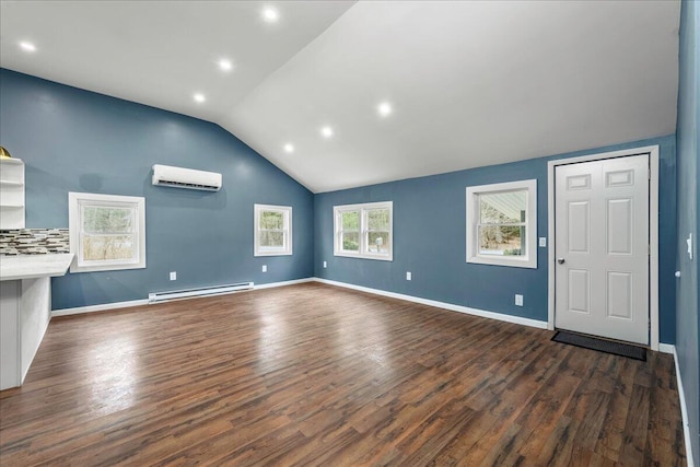 unfurnished living room with dark wood-style floors, a wall mounted AC, a baseboard radiator, and vaulted ceiling