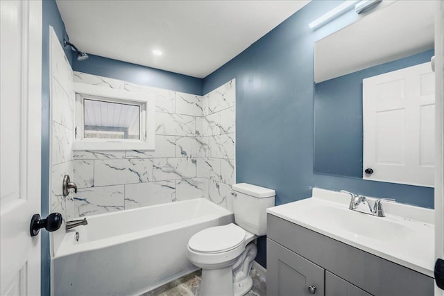 bathroom featuring washtub / shower combination, vanity, and toilet