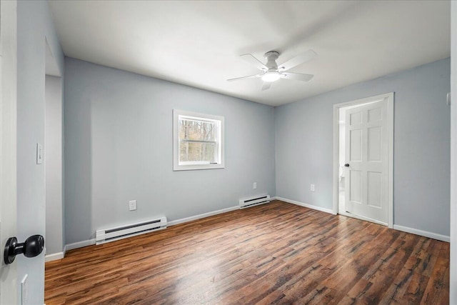 spare room featuring a ceiling fan, a baseboard radiator, baseboards, and wood finished floors