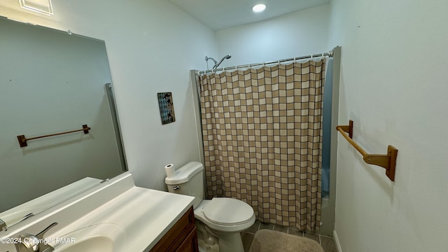 full bathroom featuring shower / tub combo with curtain, vanity, toilet, and tile patterned floors