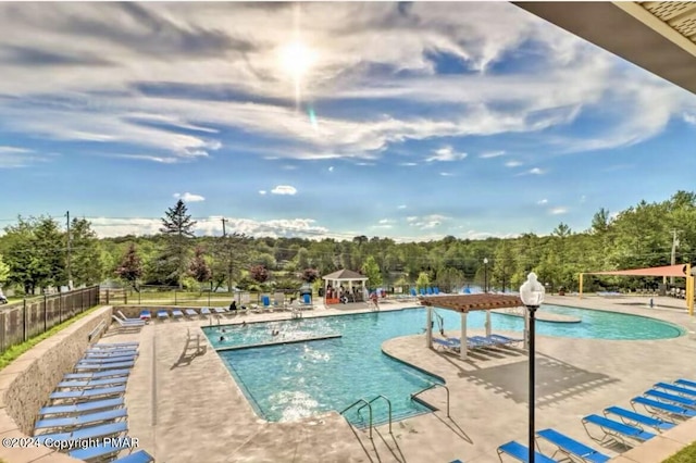 view of swimming pool with a patio area