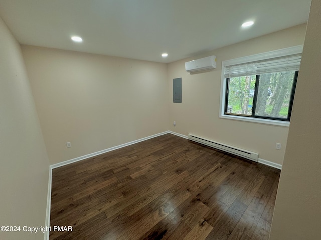 empty room with a baseboard radiator, a wall mounted AC, electric panel, and dark hardwood / wood-style flooring