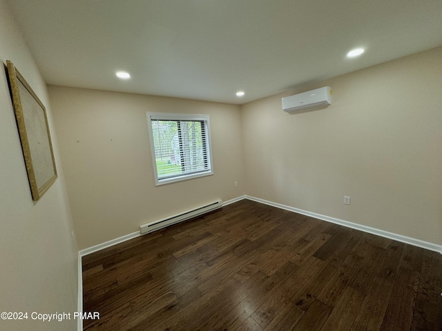 empty room featuring dark wood-type flooring, a wall mounted air conditioner, and a baseboard heating unit