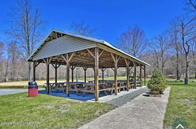 surrounding community with a gazebo and a lawn