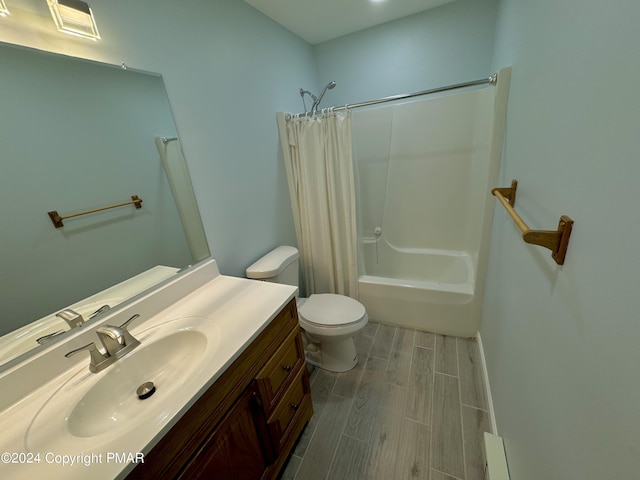 bathroom featuring vanity, toilet, wood tiled floor, and shower / bath combination with curtain