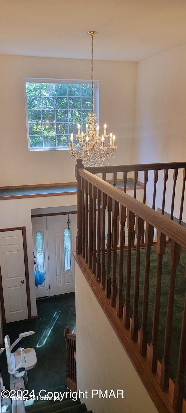 361 Great Bear Way Rd, East Stroudsburg, PA 18302 - stairway featuring a high ceiling and a chandelier