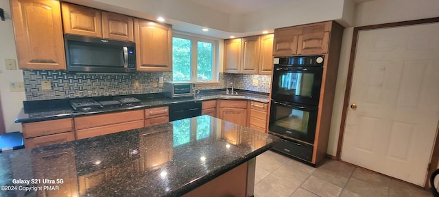 361 Great Bear Way Rd, East Stroudsburg, PA 18302 - kitchen featuring a toaster, dark stone counters, decorative backsplash, a sink, and black appliances