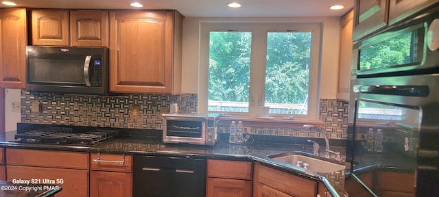 361 Great Bear Way Rd, East Stroudsburg, PA 18302 - kitchen featuring tasteful backsplash, dark stone countertops, a toaster, a sink, and black appliances
