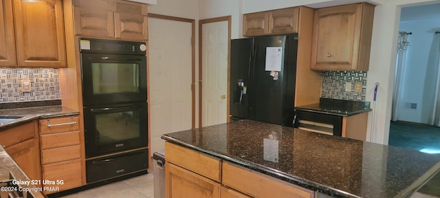 361 Great Bear Way Rd, East Stroudsburg, PA 18302 - kitchen featuring tasteful backsplash, dark stone countertops, black appliances, a warming drawer, and light tile patterned floors