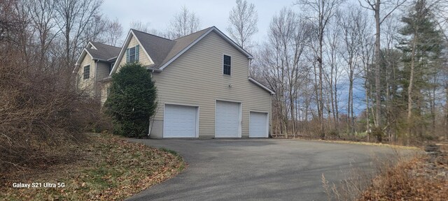 361 Great Bear Way Rd, East Stroudsburg, PA 18302 - view of property exterior with driveway and a garage
