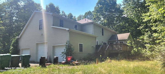 361 Great Bear Way Rd, East Stroudsburg, PA 18302 - rear view of house featuring a garage and a wooden deck