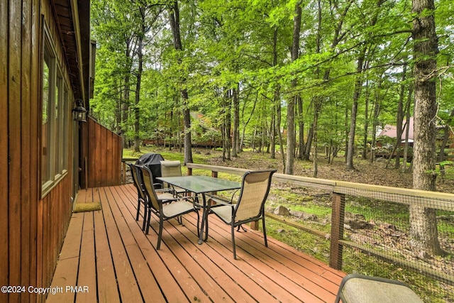 deck featuring outdoor dining area