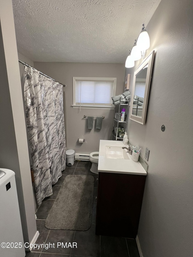 full bath featuring a textured ceiling, a baseboard radiator, tile patterned flooring, toilet, and vanity