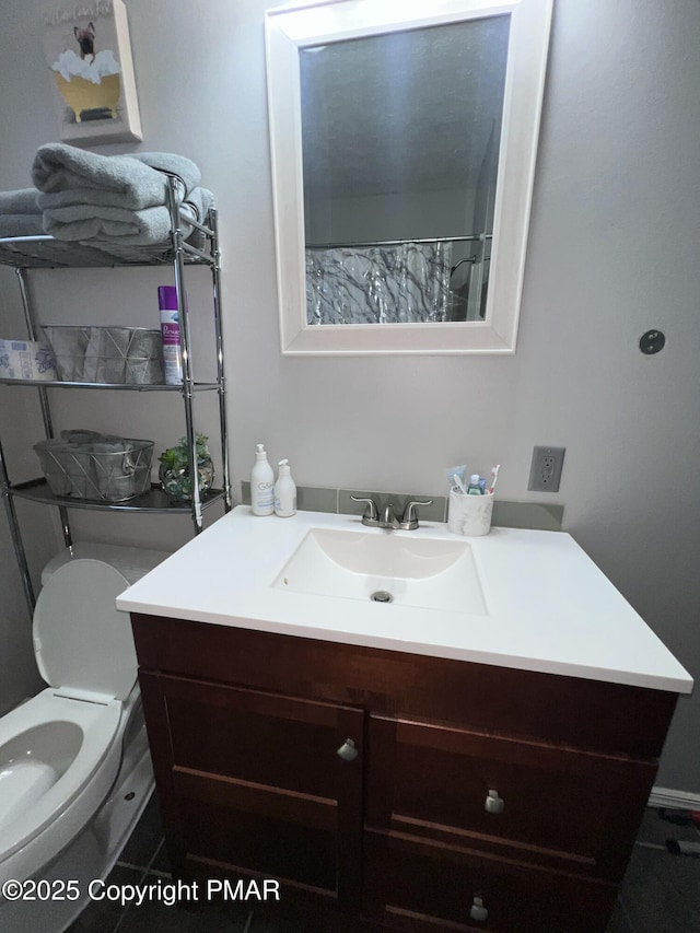 full bathroom with vanity and toilet