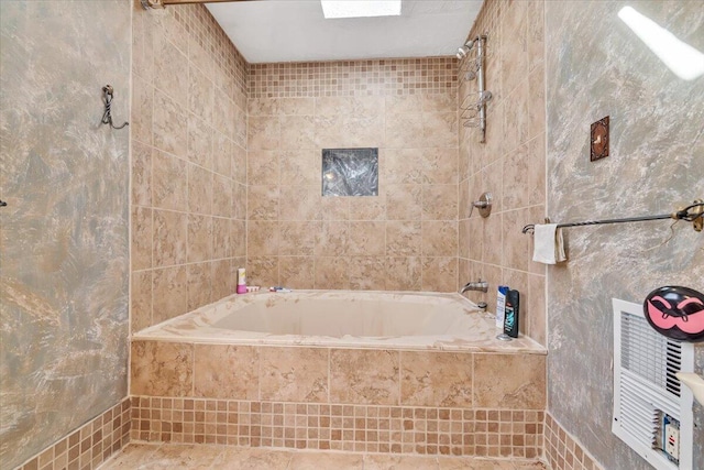 full bath with tiled shower / bath and tile walls