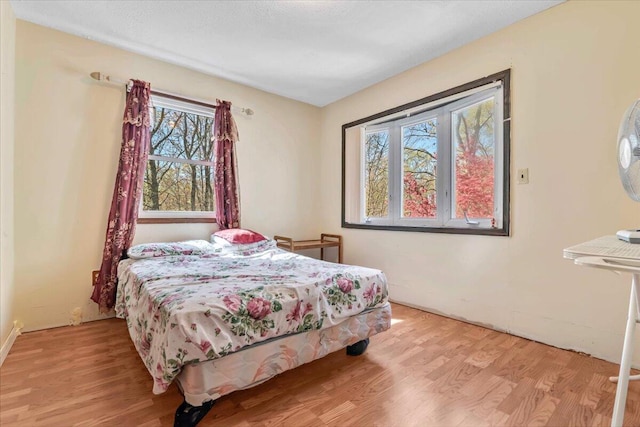 bedroom featuring wood finished floors