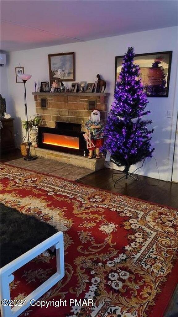 living room with a warm lit fireplace