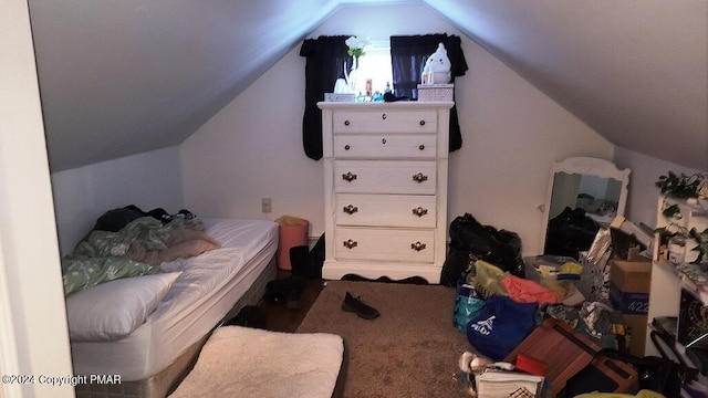 bedroom featuring lofted ceiling