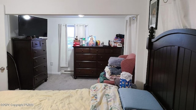 bedroom with carpet and a baseboard radiator