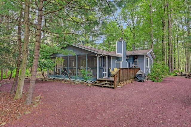 115 Alpine Ct, Pocono Pines, PA 18350 - rear view of property with a chimney, a sunroom, and a deck
