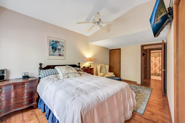 115 Alpine Ct, Pocono Pines, PA 18350 - bedroom with lofted ceiling, light wood-type flooring, and a ceiling fan