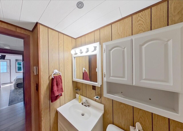 115 Alpine Ct, Pocono Pines, PA 18350 - half bathroom with vanity and wood walls