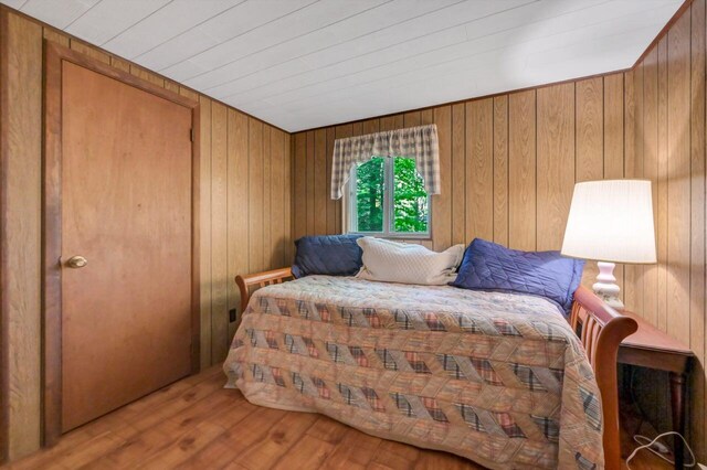 115 Alpine Ct, Pocono Pines, PA 18350 - bedroom featuring wood finished floors, wooden walls, and wood ceiling