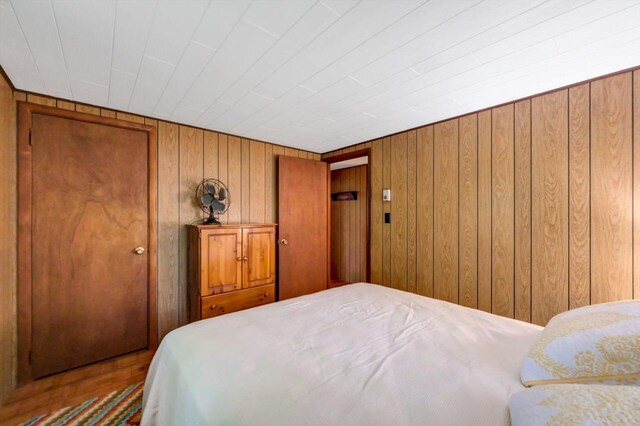 115 Alpine Ct, Pocono Pines, PA 18350 - bedroom featuring wood walls