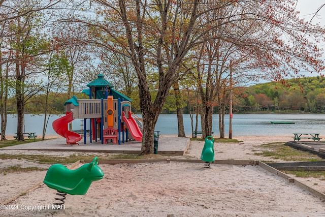 community jungle gym featuring a water view