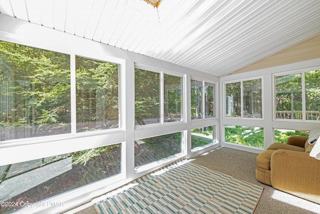 unfurnished sunroom with vaulted ceiling