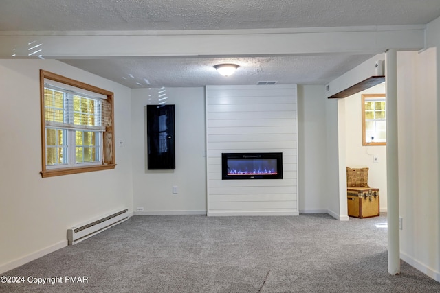 unfurnished living room featuring carpet, visible vents, a fireplace, a textured ceiling, and baseboard heating