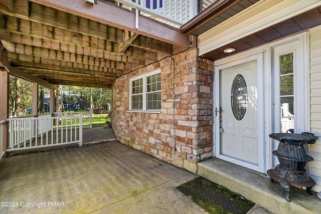 doorway to property featuring stone siding