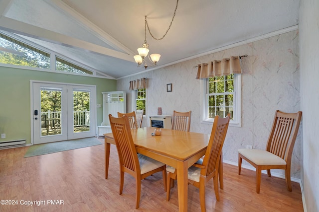 dining room with wood finished floors, baseboards, vaulted ceiling, crown molding, and a notable chandelier